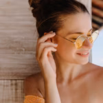 smiling-cute-woman-enjoying-summer-photoshoot-close-up-shot-laughing-tanned-caucasian-girl-wears-yellow-sunglasses_197531-8952